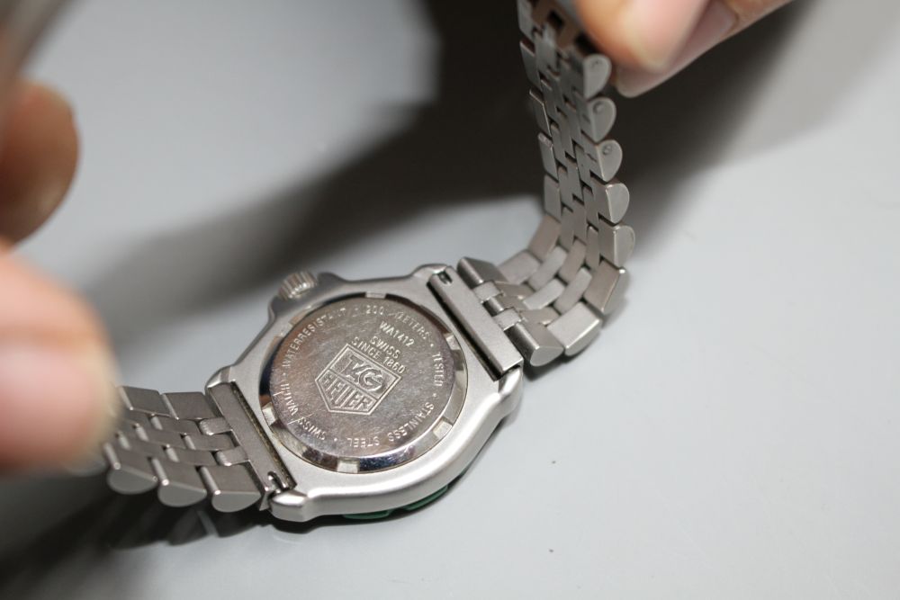 A ladys stainless steel Tag Heuer Professional quartz wrist watch, on Tag bracelet.